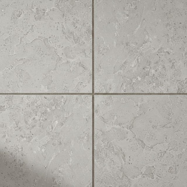 Flooring sample: four light gray stone-look tiles with subtle veining